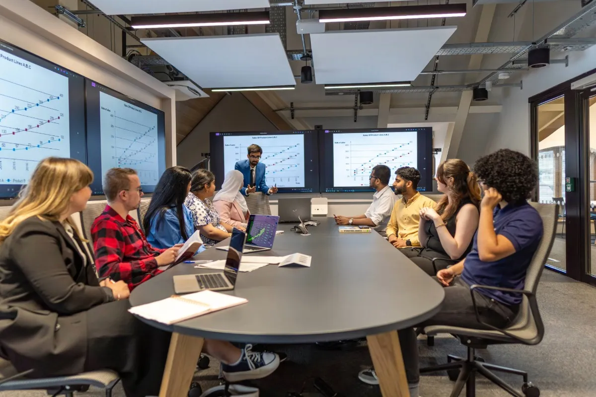 A group of students working together as a group at Leeds City Campus.