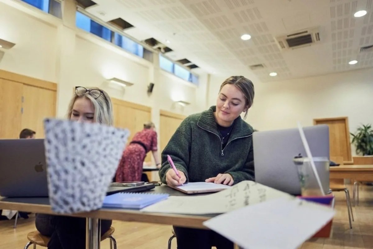 Students working on laptops and making notes at our Main Campus.