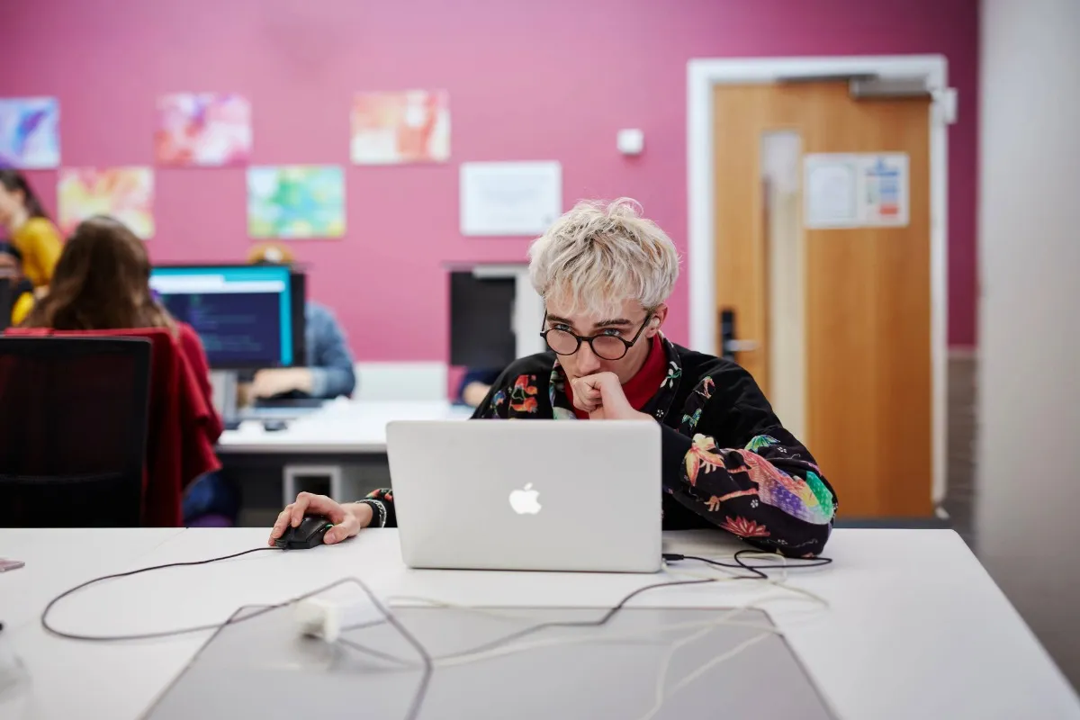 Student working on a computer in a classroom at Main Campus.