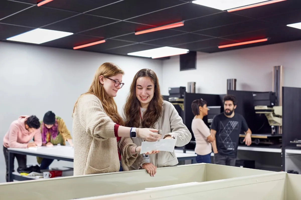 Students using camera equipment in the Photography Studio.