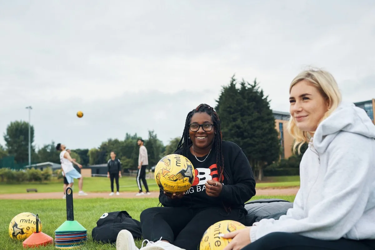 Students playing sports outside at Main Campus.