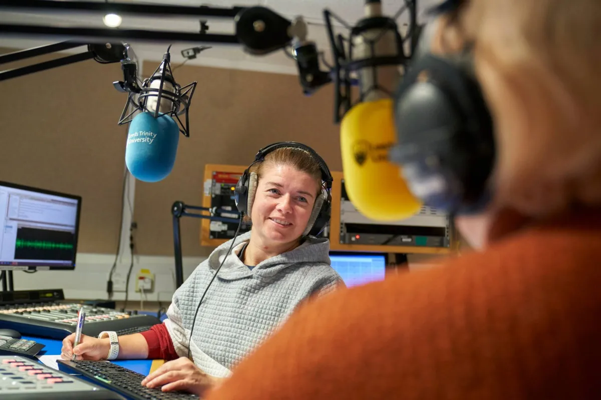 Sports Journalism student working in the radio studio at Main Campus.
