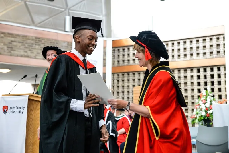 Dalton Tulloch graduation. With Chancellor .