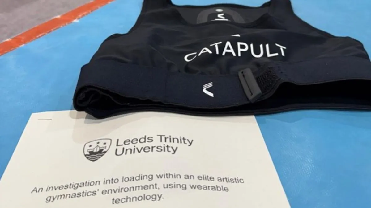 A picture of a GPS sports vest and a research paper.