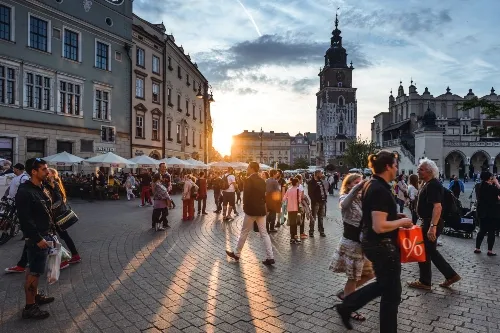 People walking on a concrete street .