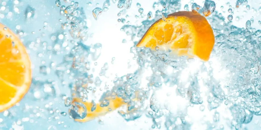 Water droplets and orange segments.