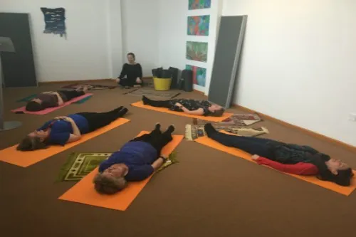Staff members participating in mindfulness .