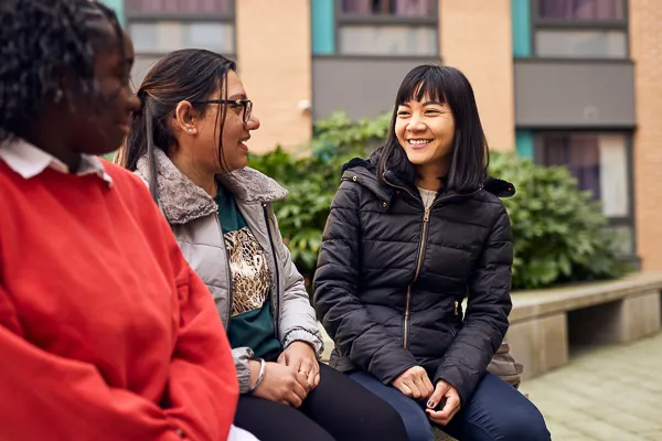 Students relaxing in Fountains Court courtyard.