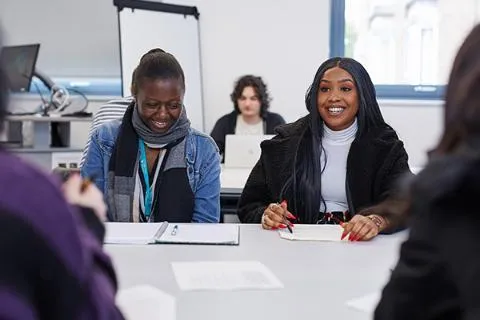 Students socialising in a lecture.