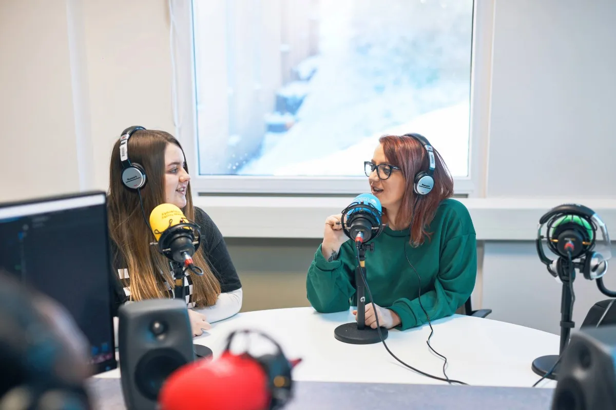 Students using podcasting equipment.