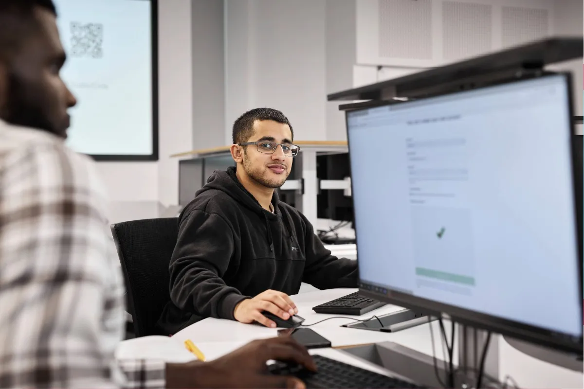 A student using the computer.
