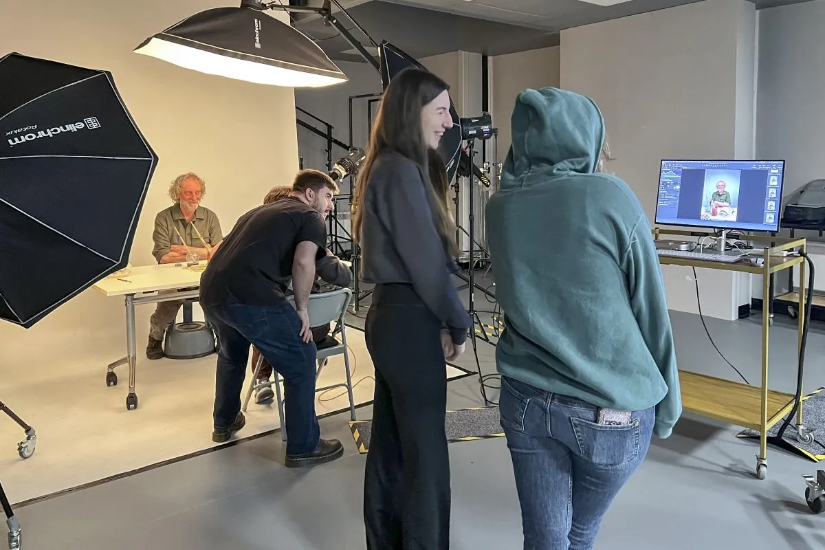 Image of students working in the Photography studio..