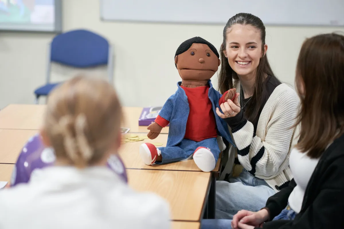 A Primary Education student working in the classroom.