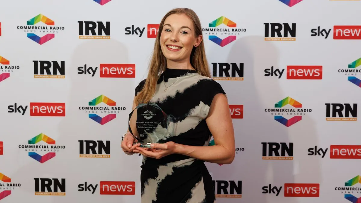 A picture of Alice Young holding her National Newsreader of the Year Award.
