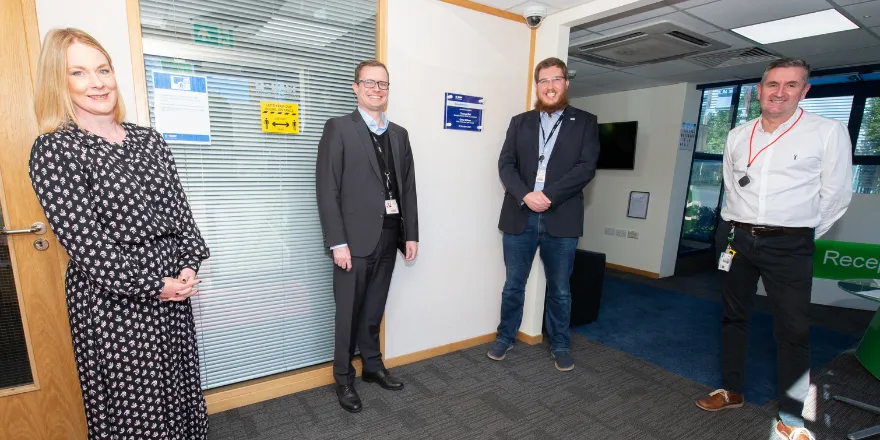 Dr Leigh Hoath (far left) stands with male colleagues from BASF at opening of ScienceXperience.
