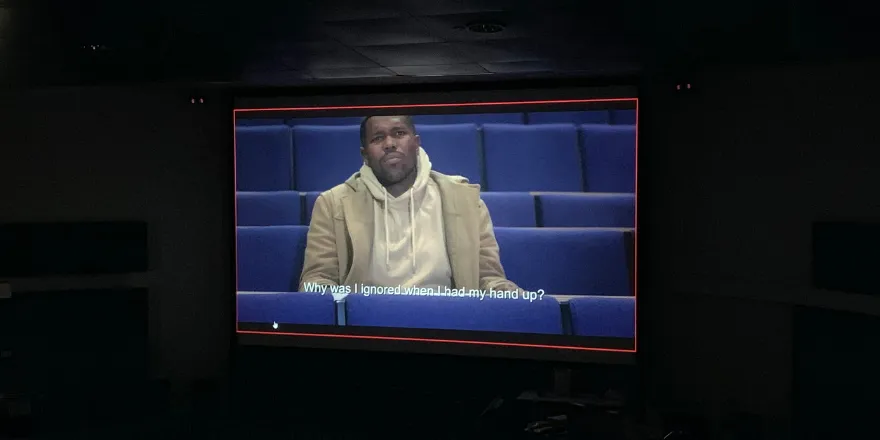 Image of projector screen showing Re:Tension.