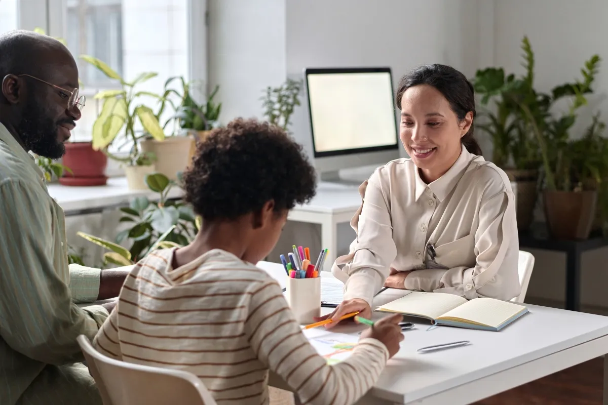 Image of Health and Social Care worker with family..