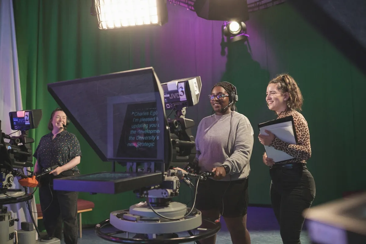 Students filming in TV centre.