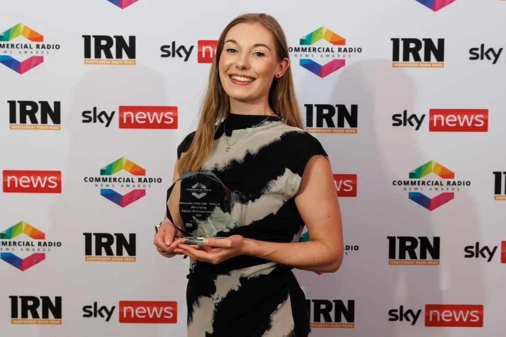 Image of alumna, Alice Young winning the IRN Award..