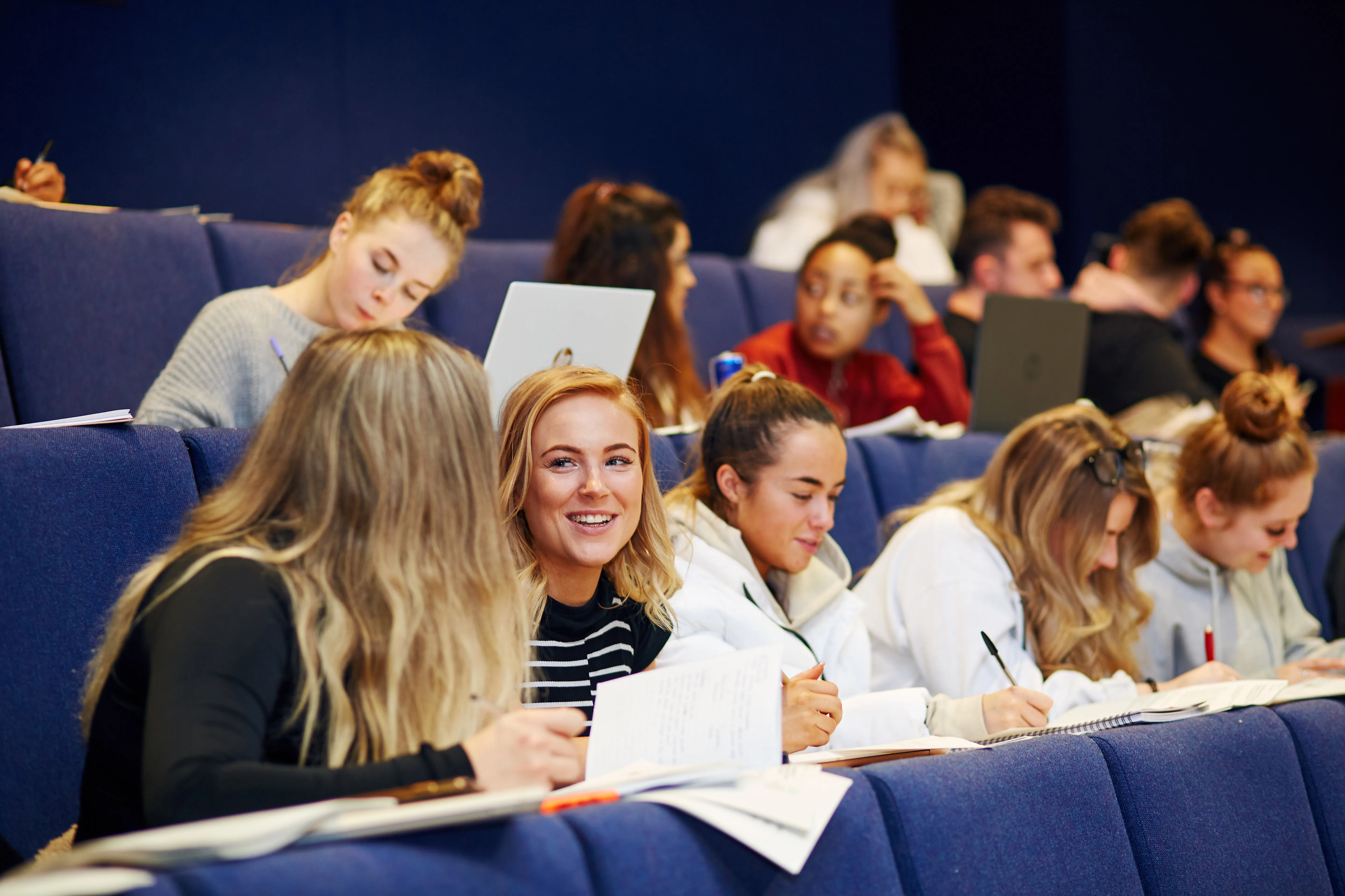Students learning in a lecture theatre..
