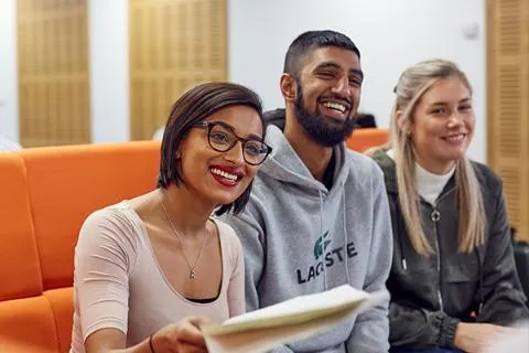 Students learning together in social space.