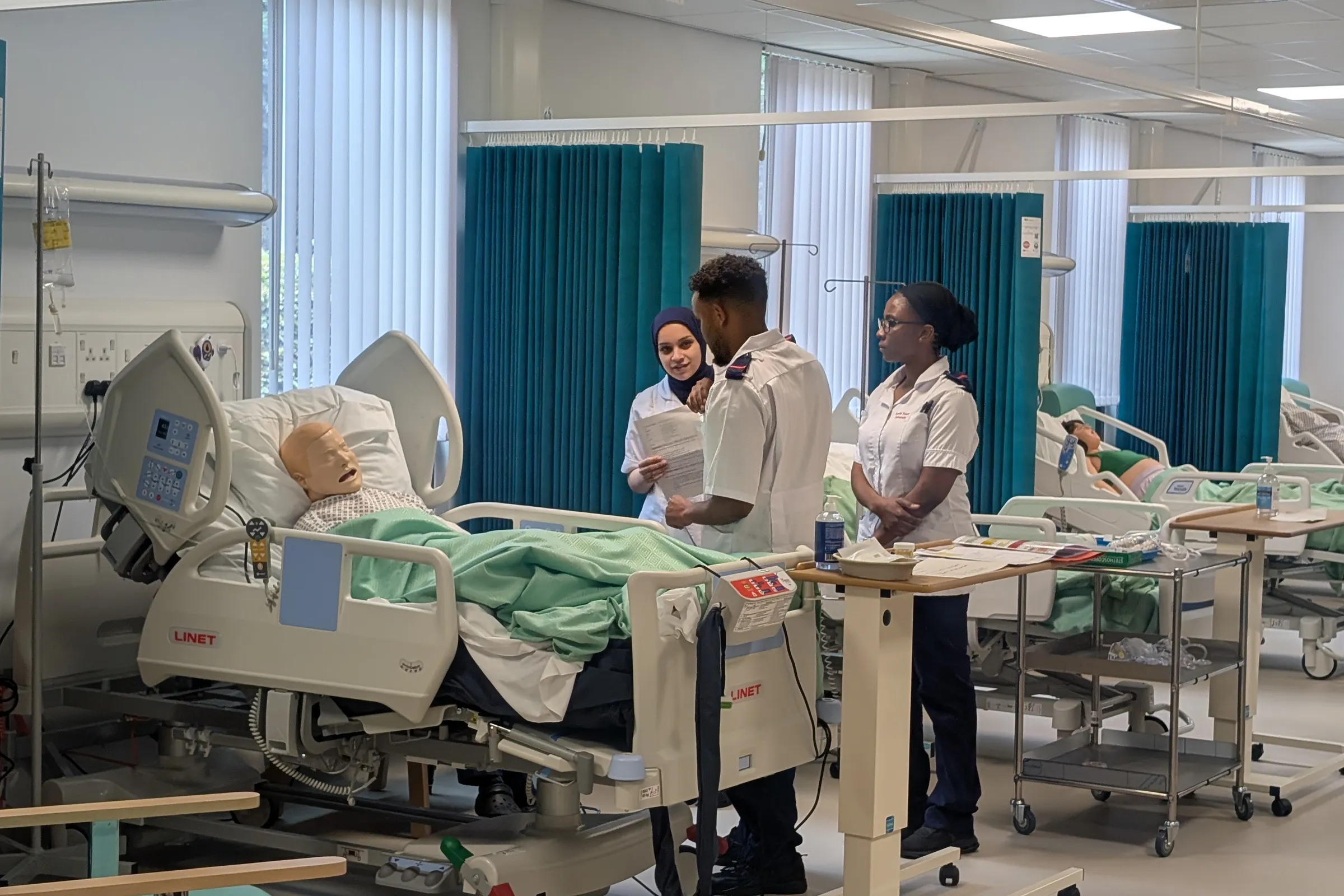 Image of first year Nursing students taking apart in a simulation week.