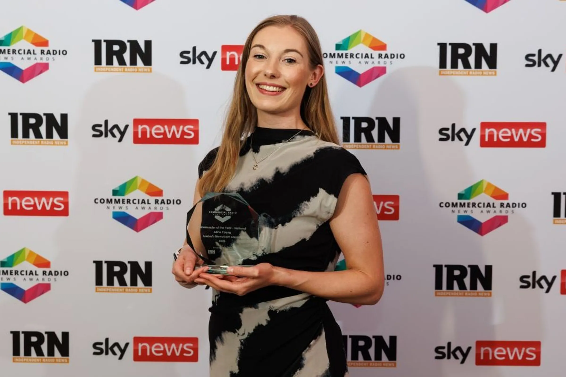 Image of alumna, Alice Young winning the IRN Award.