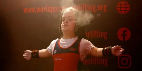 Female athlete in Team GB outfit with chalk