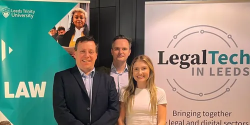 three people, one woman and two men, smiling celebrating law partnership to help others