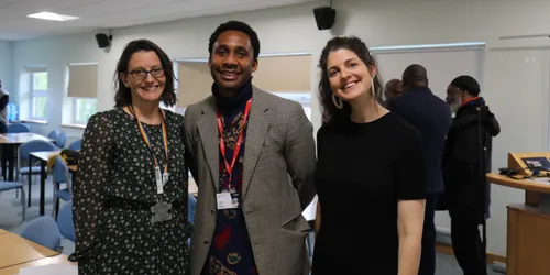 Female on the left, man in the middle and a female to the right at a community event