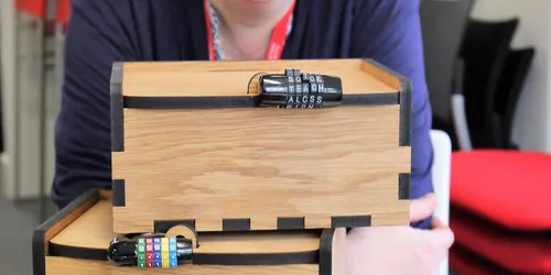 Light wooden box with black lock