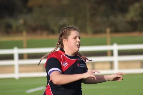 Megan Price playing rugby