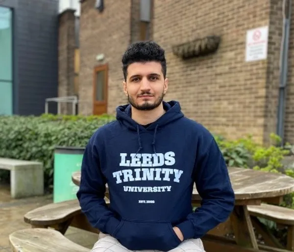 Alumni sitting on Main Campus