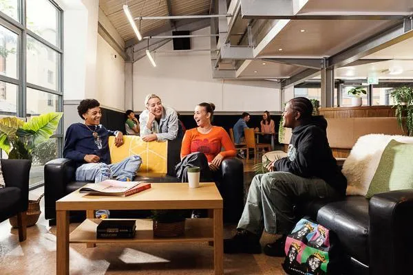 students relaxing in Clarence Dock Village Common Room