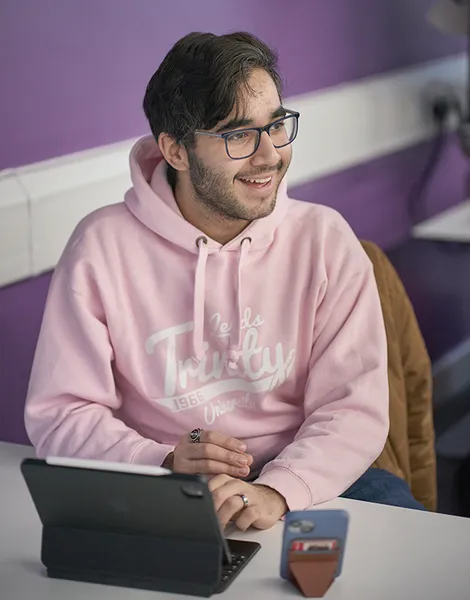 Student working on tablet in seminar