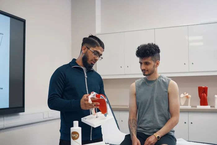 Two students working in our Sports Science Laboratory on Main Campus