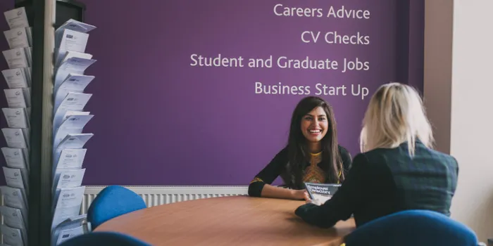 Graduate receiving advice and support at university