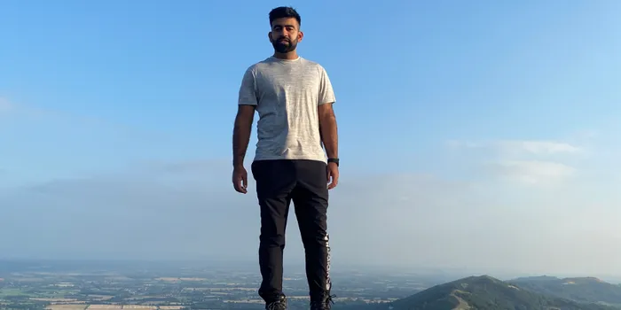 Man standing on top of a hill