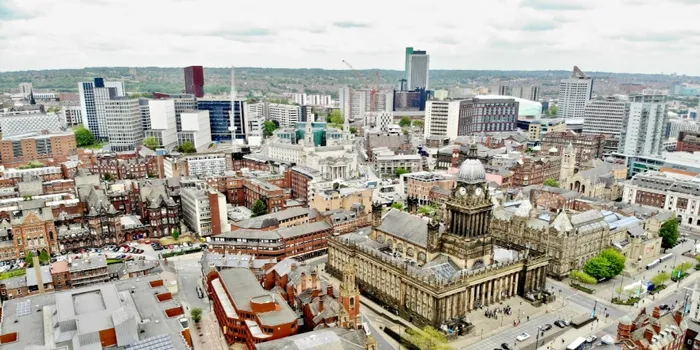 Aerial view of Leeds city centre including Town Hall and brick buildings