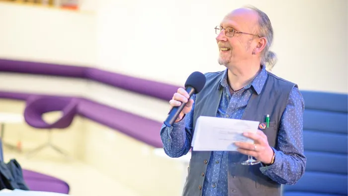 An academic giving a speech.