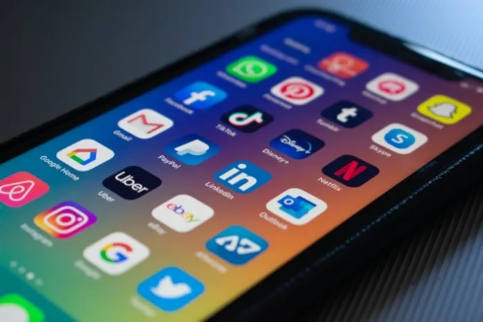 Mobile phone displaying social networking apps 
