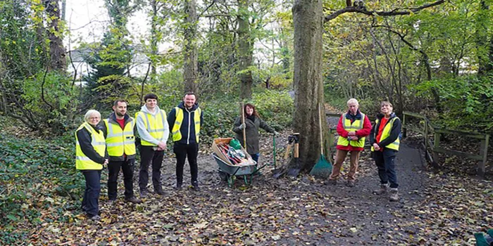 A group of people volunteering in Hunger Hills Woods.