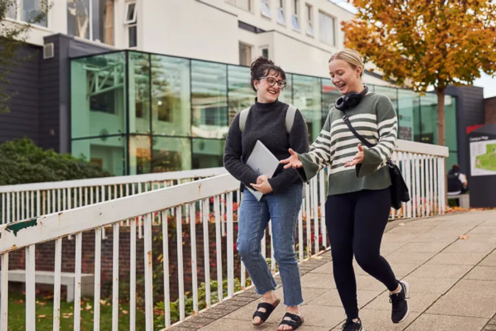 Students walking outside Main Campus entrance