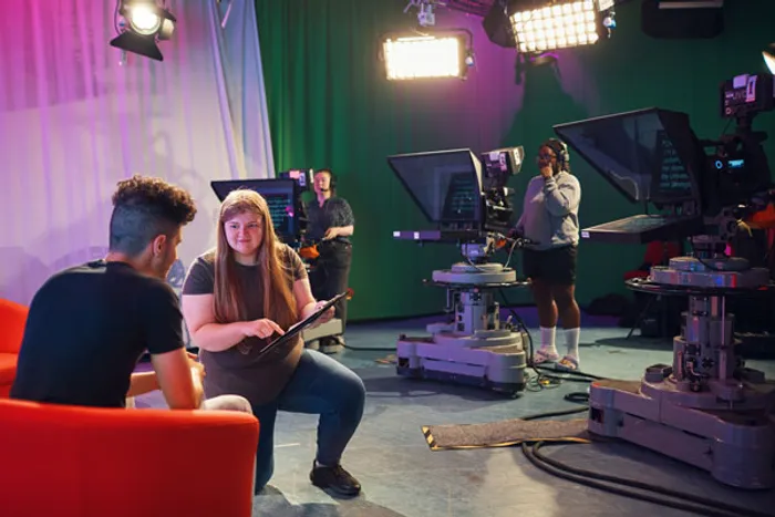 Students in a TV studio.
