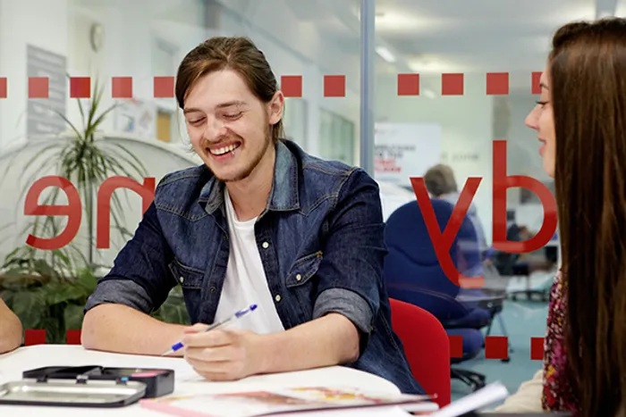 student studying in a library study room 