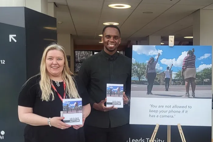 Dr Ann Marie Mealey and Leeds Church Institute in Leeds Trinity University Atrium.