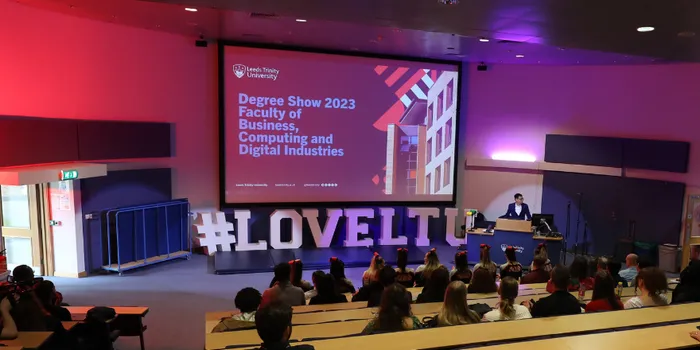 Auditorium filled with guests at event opening