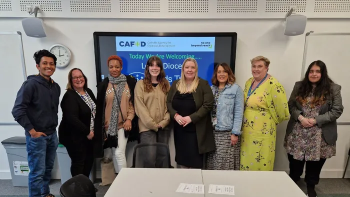 The Director of Catholic Mission in a group photo with seven other people