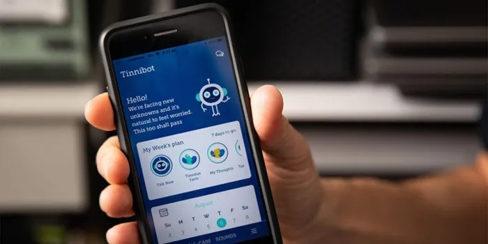 Hand holding mobile phone with blue app homepage 