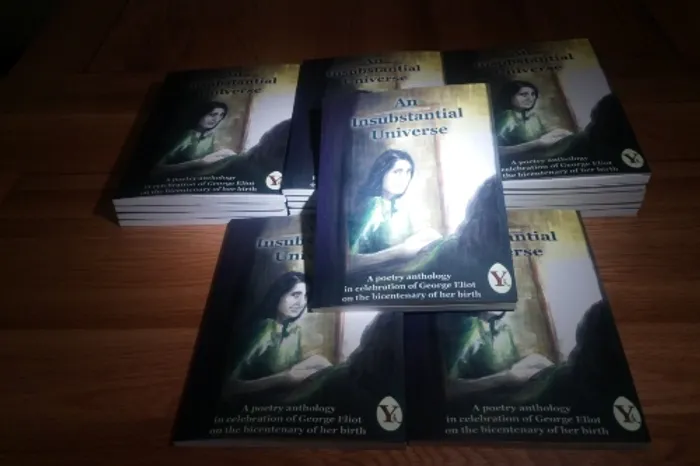 Pile of books laid out on a desk